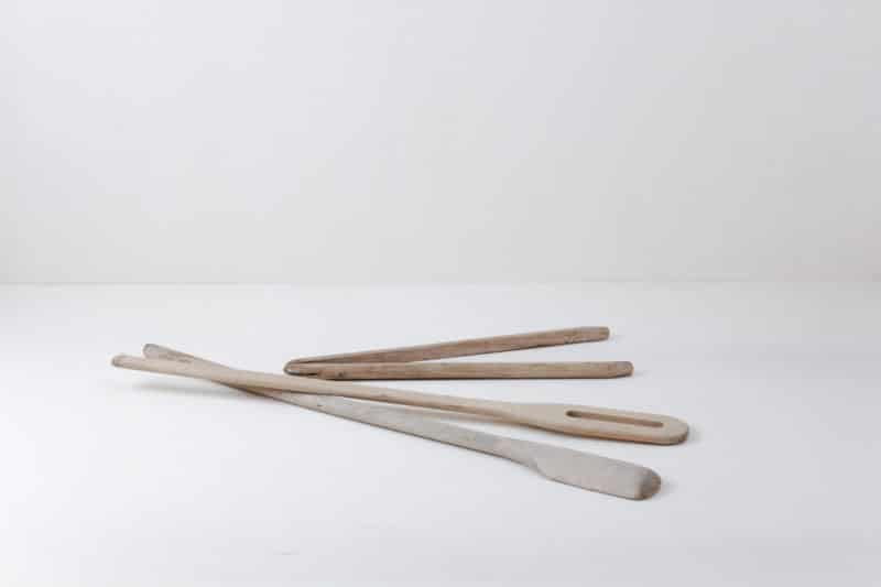 One pair of laundry tongs, two laundry sticks. Very rustic charm.