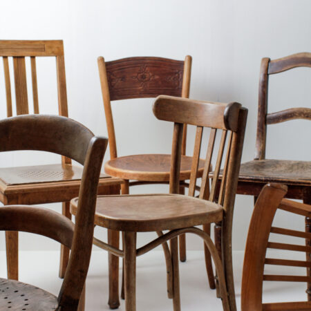 Wooden Dining Chairs Carlos Vintage Brown Mismatching | These vintage mismatching wooden chairs enhance any dinner table. The individual shapes and designs, the different shades of brown and patina create a unique but appealing picture at your party, wedding or event.Up to 400 chairs can be rented, making it possible to create a long table setting or a presentation without a chair connector. | gotvintage Rental & Event Design